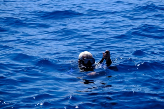 Illustration of the diver's ascent to the water surface while diving. photo