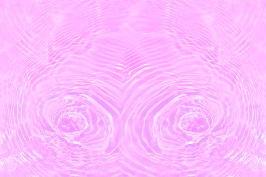 Defocus blurred transparent purple colored clear calm water surface texture with splashes and bubbles. Trendy abstract nature background. Water waves in sunlight with copy space. Pink water drop shine photo