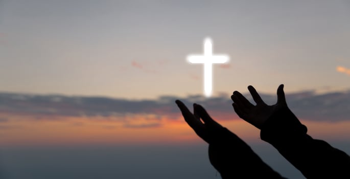 Silhouette of woman hand praying spirituality and religion, female worship to god. banner with copy space. Religious people are humble to God. Christians have hope faith and faith in god. photo