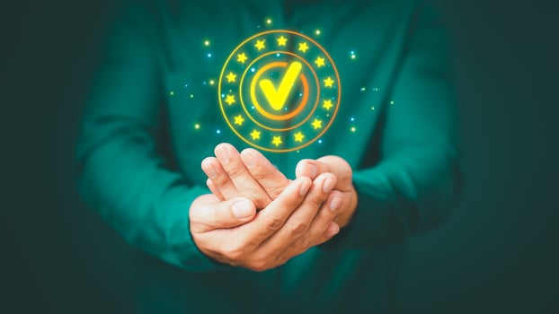 Quality assurance of business services, Businessman holding and showing the best quality assurance with golden five stars. Guarantee, Standards, ISO certification and testimonial concept. photo