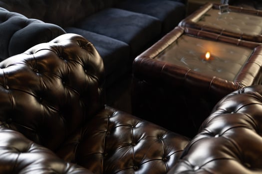 Sofa Chester in an interior. seat leather sofa. Selective focus. photo