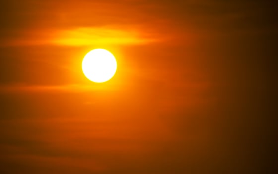The sun at sundown. Sunset sky background photo