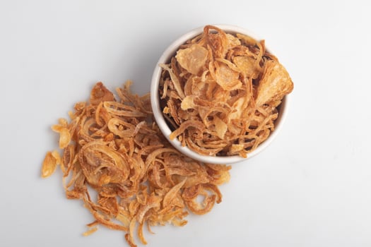 Crispy fried onion slices on a white background photo