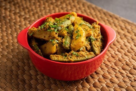 Aloo Potol or Dalna Recipe is a traditional sabzi from bengal made with potato and pointed gourd photo
