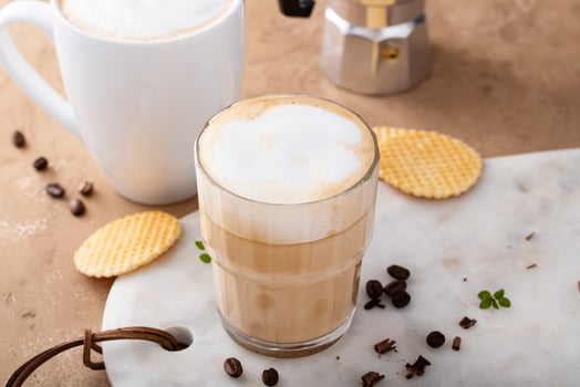 Hot coffee latte and cappuchino in a glass and mug photo