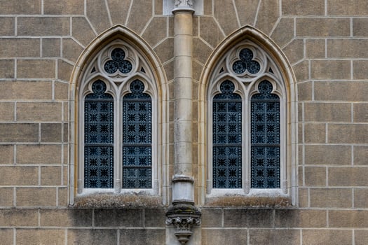 Gothic medieval stained glass window and stone arch.  Architectural element. photo