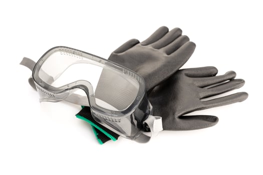 Protective safety glasses and work gloves isolated on white background photo