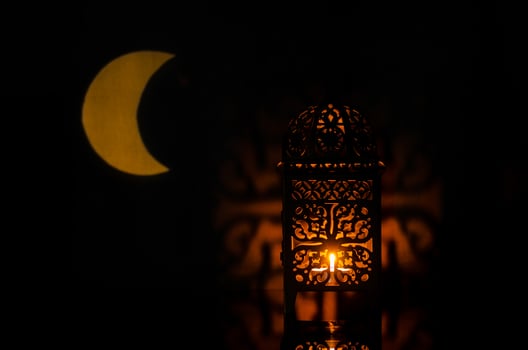 Lantern with moon shape from light on background for the Muslim feast of the holy month of Ramadan Kareem. photo