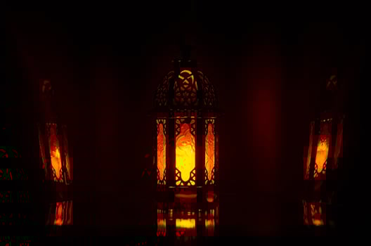 Lantern with reflection from background for the Muslim feast of the holy month of Ramadan Kareem. photo