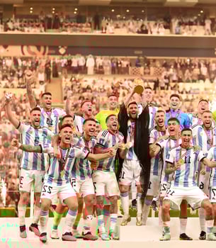 Luseyl, QATAR - DEC 18 2022, Lionel Messi and team friends celebrating with the championship cup at the World Cup match between Argentina and France at the Luseyl Stadium on December 18, 2022 photo