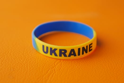 blue and yellow wristband , colors of flag of Ukraine. photo