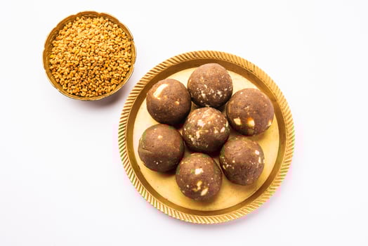 Fenugreek or methi ke Laddu, laddo or laddoo or sweet mithai balls for boosting immunity in winters photo