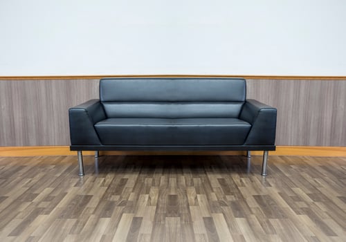 Black leather sofa in the living room photo