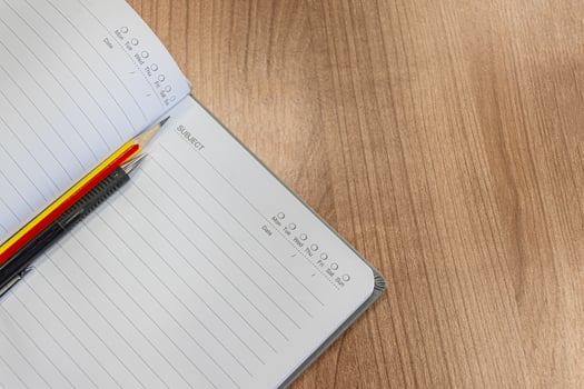 Notebooks with pencil and pen on the table photo