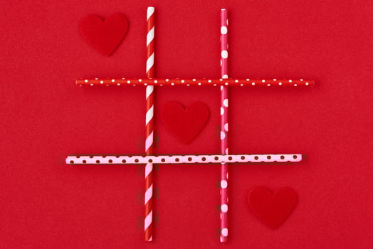 Valentines day. Hearts on red background, creative concept photo