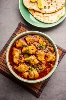 Punjabi soya chaap gravy or dhaba style soya chap masala sabzi served with naan photo
