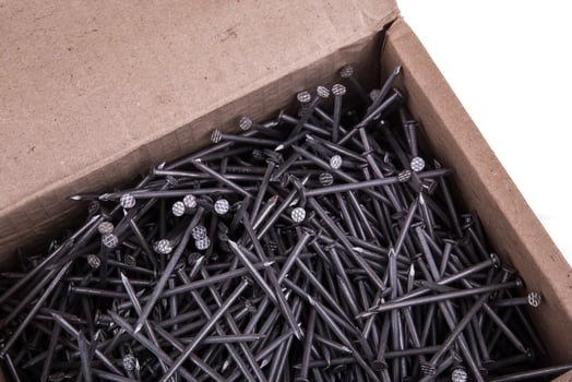 Nails in a box on a white background photo