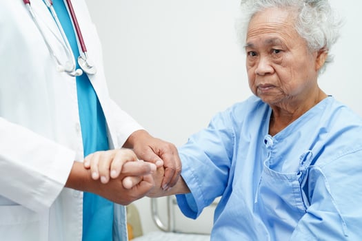 Doctor holding hands Asian elderly woman patient, help and care in hospital. photo