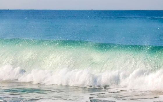 Extremely huge big surfer waves at beach Puerto Escondido Mexico. photo