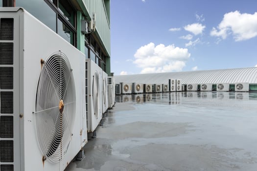 Close up air compressor on rooftop photo