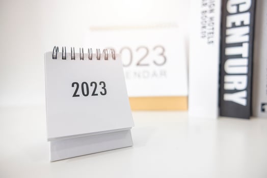 2023 business calendar on office table in new year day. Make a work plan for the start of the year. Concept about Celebration, Business, Christmas, New Year. photo