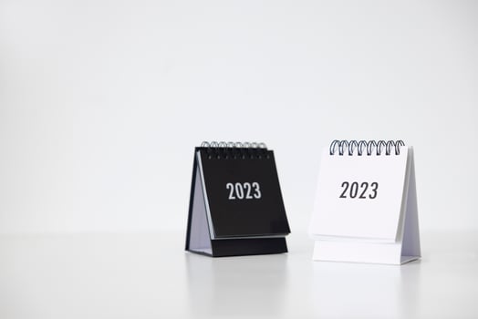 2023 business calendar on office table in new year day. Make a work plan for the start of the year. Concept about Celebration, Business, Christmas, New Year. photo