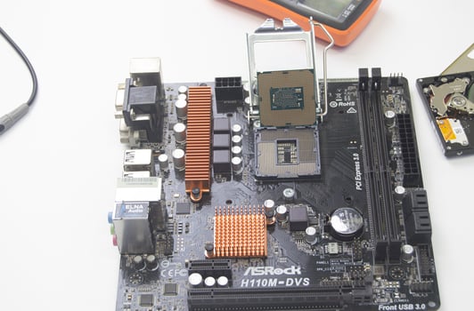 top view technician repairing motherboard photo