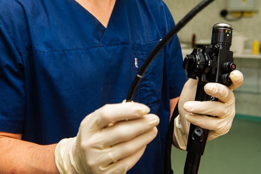 Endoscope in the hands of doctor. Medical instruments used in gastroscopy.Gastric probe photo