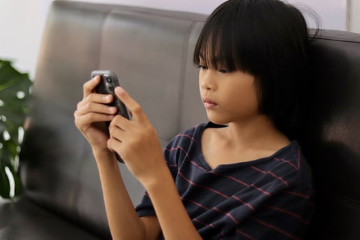 Child sitting on the phone photo