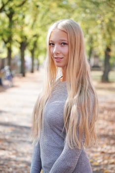portrait of teenage girl enjoying sunny day outdoors photo