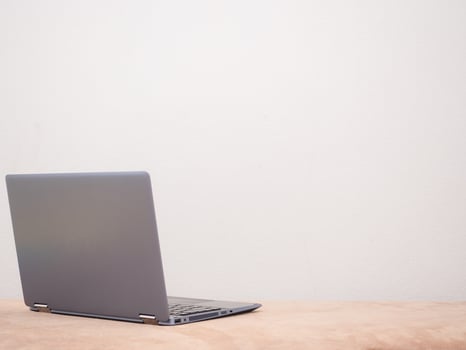 Laptop on sofa silver color on white background copy space concept photo
