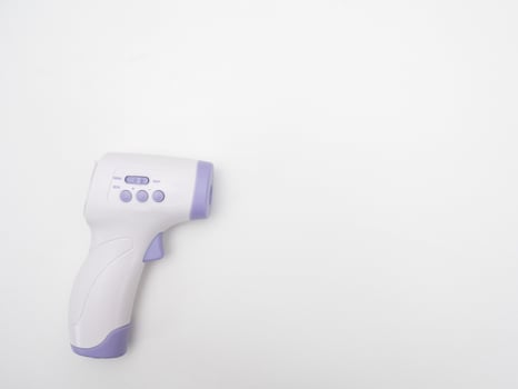 Infrared thermometer scan on white background copy space photo