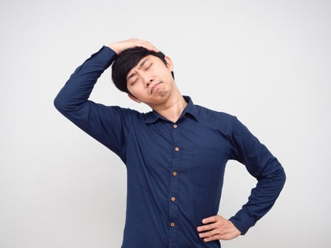 Asian man feeling lazy stretch oneself portrait white background photo