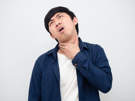 Man feeling pain his neck unhappy face portrait white background photo