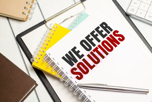 We offer solutions. Conceptual background with chart ,papers and pen photo