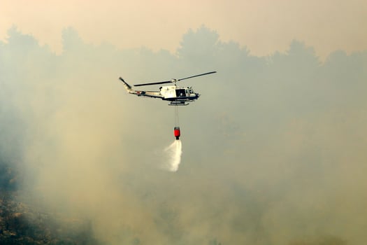 A helicopter puts out a forest fire in the mountains of northern Israel. photo