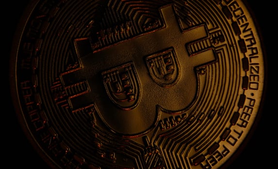 Golden sign bitcoin virtual crypto currency btc. Electronic decentralised money, modern payment, finance, online business, stock, savings, investments. Convenient payment in global economy market. photo