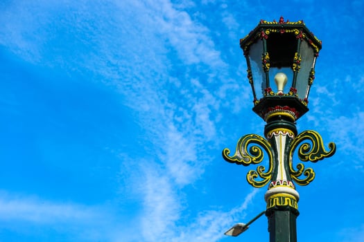 Typical Street Lamp in Malioboro with blue sky background and white cloud. photo