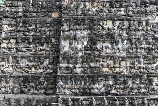Angkor Thom - Stone carving on the wall, Angkor Thom, Apsara carved photo