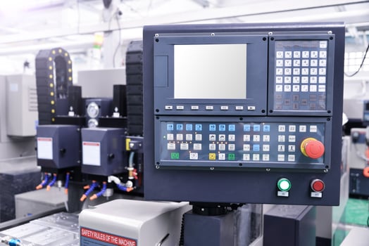 CNC machine with controller console in factory photo