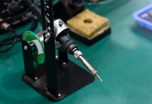 soldering iron and tin string photo