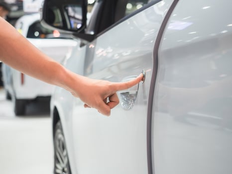 Hand scan door car white color and blur event motor show concept photo
