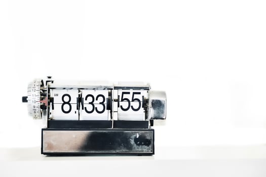 Alarm clock on table photo