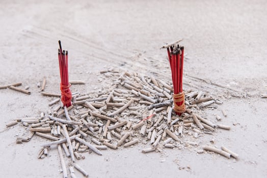 incense sticks in ash pot photo