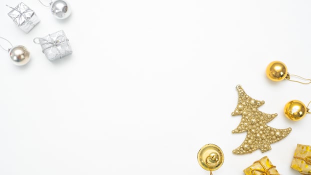 Golden and silver christmas items on white background top view copy space photo
