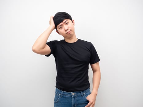 Asian man with jeans gesture touch his head photo