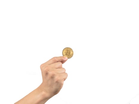 Finger holding golden bitcoin white isolated,Hand keep gold bitcoin digital money photo