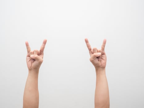 Man hand gesture double finger rock isolated white photo
