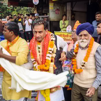 Delhi, India, December 02 2022  - Bharatiya Janata Party BJP supporter during mega road show in support of BJP candidate Pankaj Luthara to file nomination papers ahead of MCD local body Elections 2022 photo