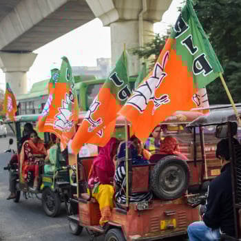 Delhi, India, December 02 2022  - Bharatiya Janata Party BJP supporter during mega road show in support of BJP candidate Pankaj Luthara to file nomination papers ahead of MCD local body Elections 2022 photo